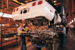 Auto workers on assembly line